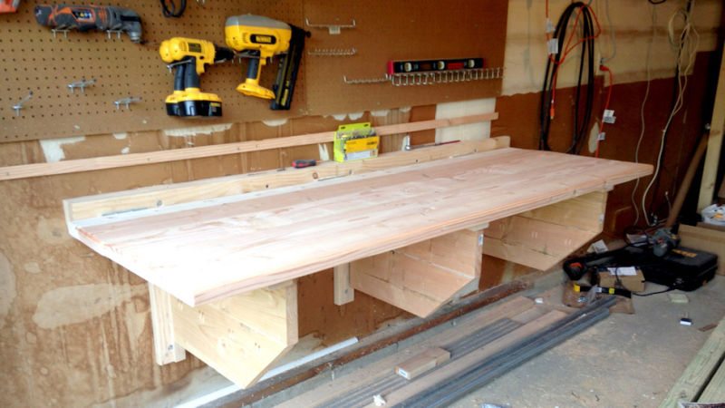 This DIY Floating Workbench Folds Into Place When It's Time to Work, Away When You're Done